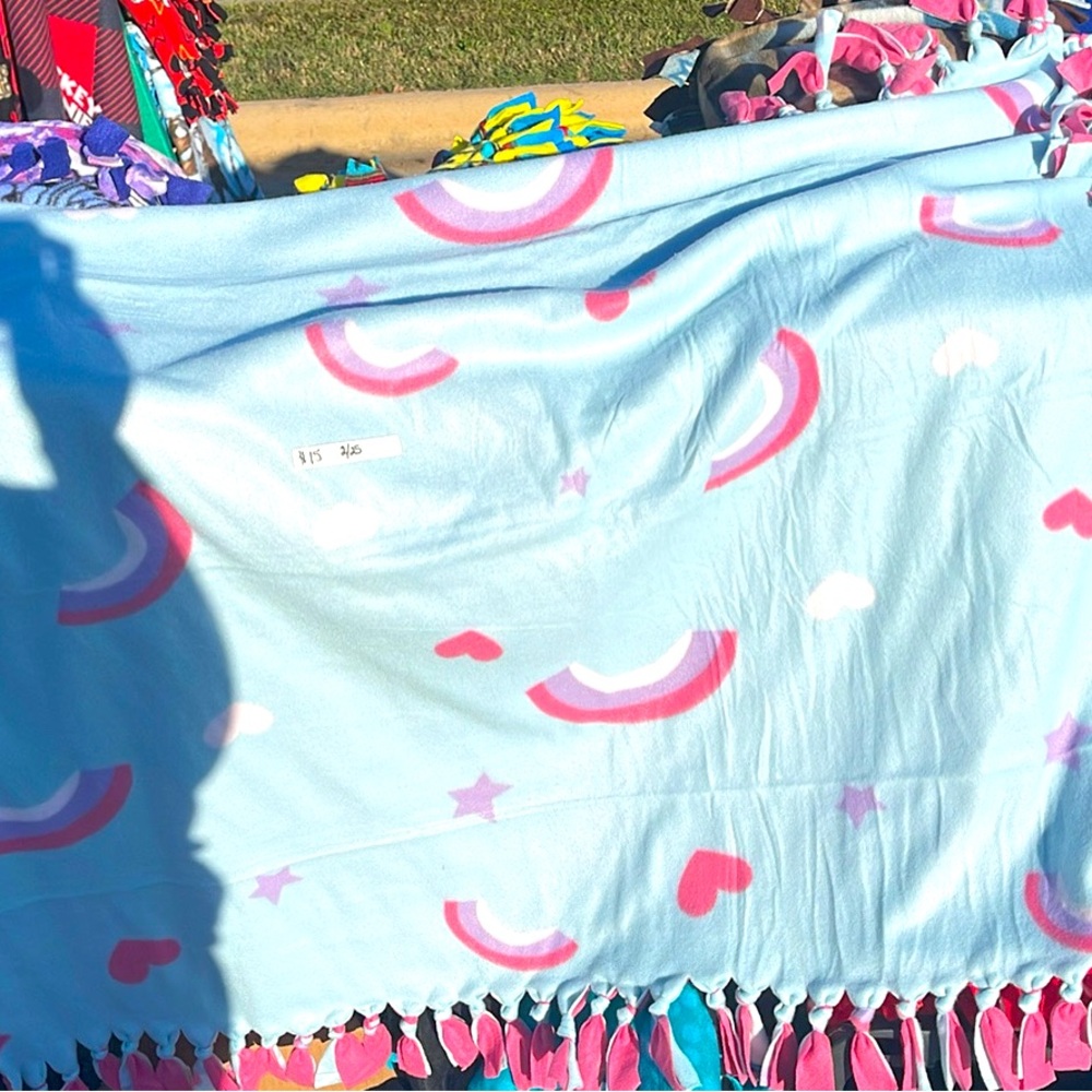 Kids size blankets in different prints.